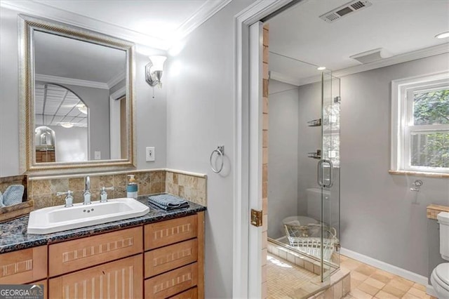 full bath with vanity, visible vents, a shower stall, crown molding, and toilet