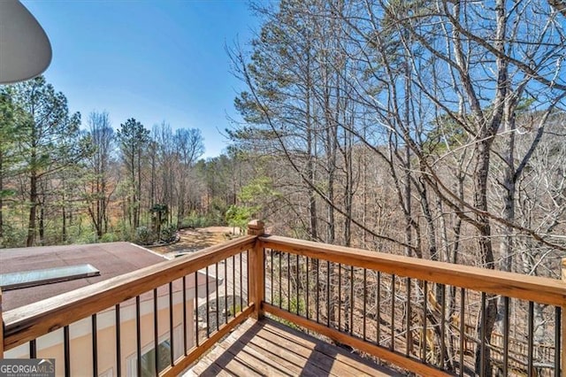 deck featuring a forest view