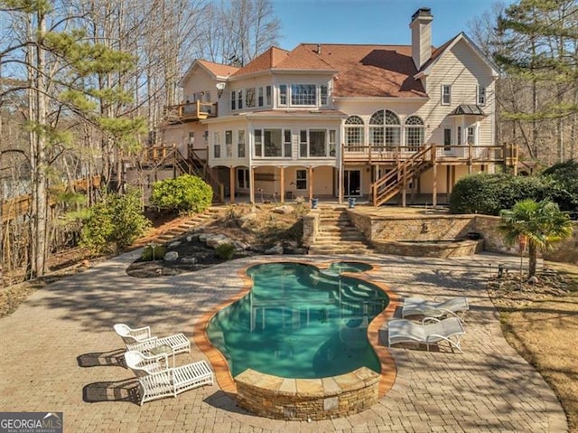 3460 Mansions Pkwy, Berkeley Lake, GA 30096 - back of house featuring stairway, a chimney, a deck, and a patio area