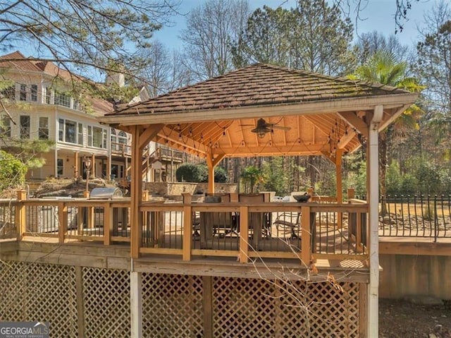 view of community with a gazebo and a wooden deck