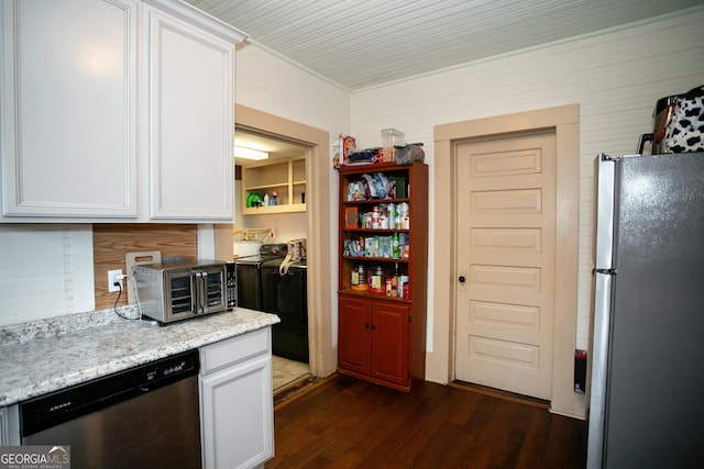 kitchen with a toaster, appliances with stainless steel finishes, light stone counters, dark wood-type flooring, and white cabinetry