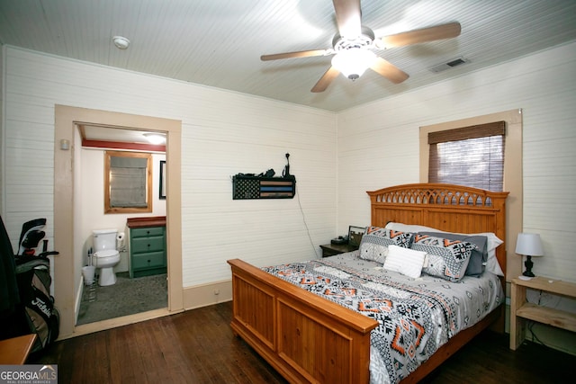 bedroom with dark wood-style floors, ceiling fan, visible vents, and ensuite bathroom