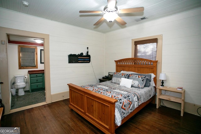 bedroom with visible vents, dark wood finished floors, and a ceiling fan