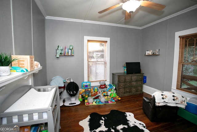 bedroom with crown molding, ceiling fan, and wood finished floors