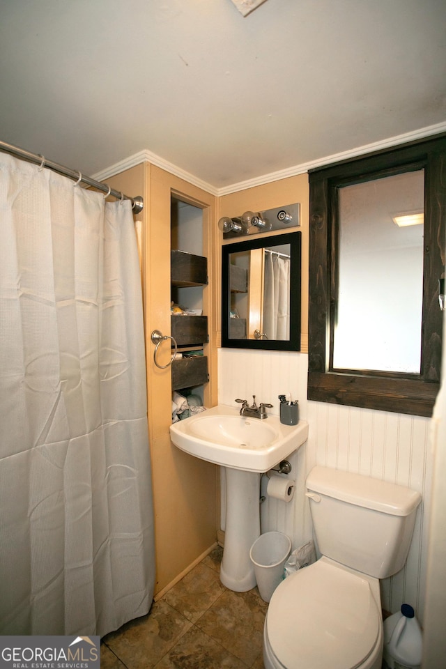 bathroom featuring curtained shower and toilet