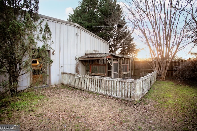 back of property with fence