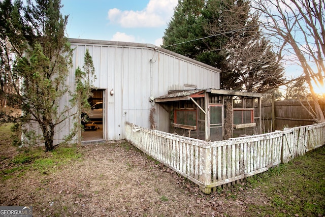 back of property featuring fence