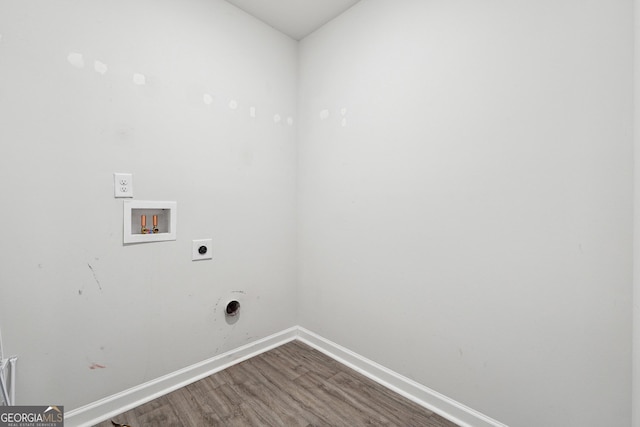 clothes washing area with hookup for a washing machine, dark wood-type flooring, electric dryer hookup, laundry area, and baseboards