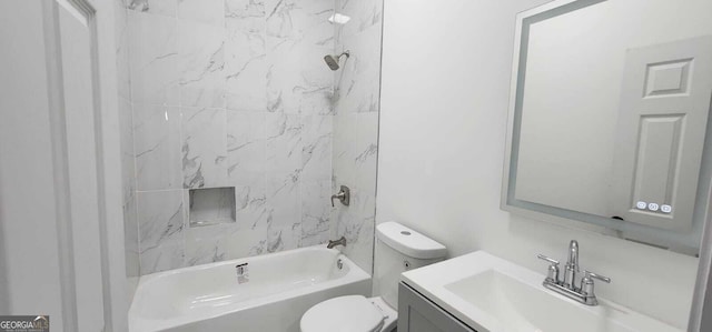 bathroom featuring vanity, toilet, and bathing tub / shower combination