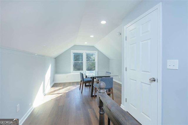 interior space featuring vaulted ceiling, recessed lighting, baseboards, and wood finished floors