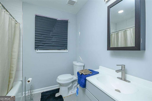 bathroom with vanity, toilet, baseboards, and visible vents