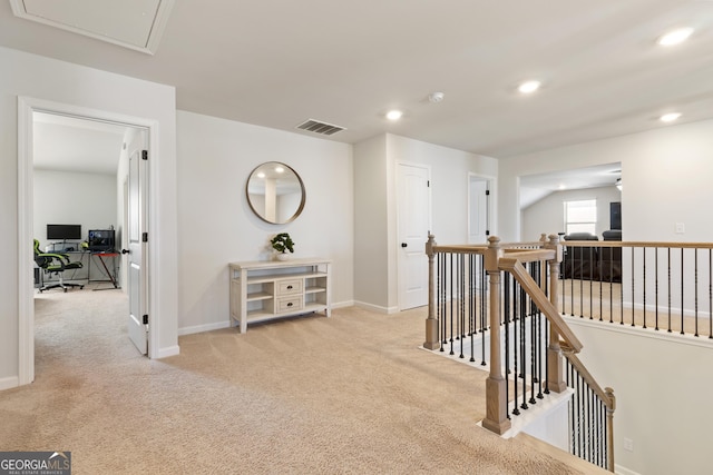 corridor with baseboards, visible vents, carpet flooring, an upstairs landing, and recessed lighting