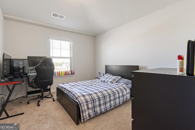 carpeted bedroom featuring vaulted ceiling, visible vents, and baseboards