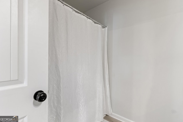 bathroom with a shower with shower curtain