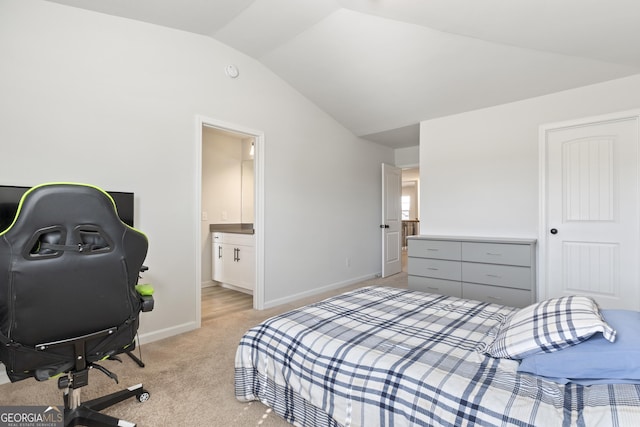 bedroom featuring lofted ceiling, light carpet, baseboards, and connected bathroom