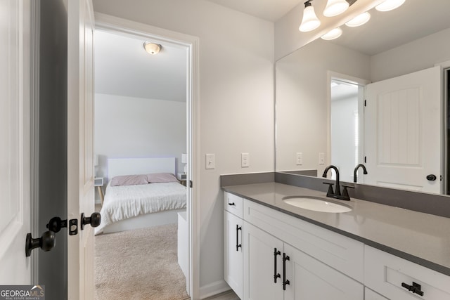 bathroom with vanity and baseboards