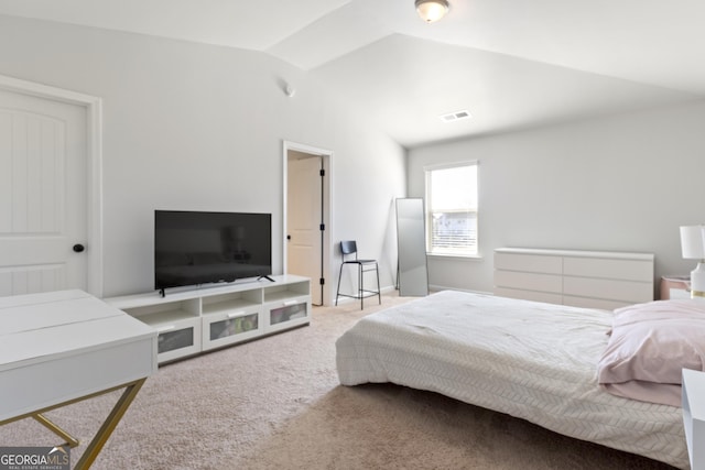 bedroom featuring lofted ceiling, carpet, and visible vents