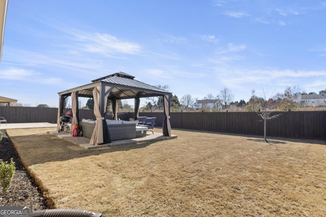 view of yard with a fenced backyard, a patio, outdoor lounge area, and a gazebo