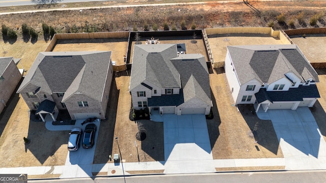 birds eye view of property with a residential view