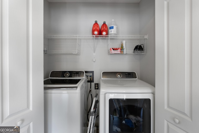 washroom with laundry area and washing machine and clothes dryer