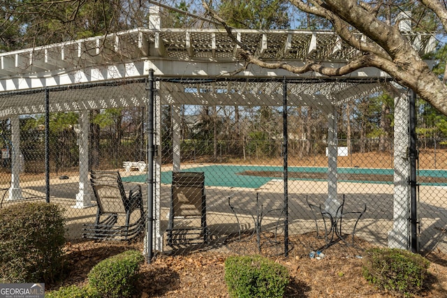 view of pool featuring fence