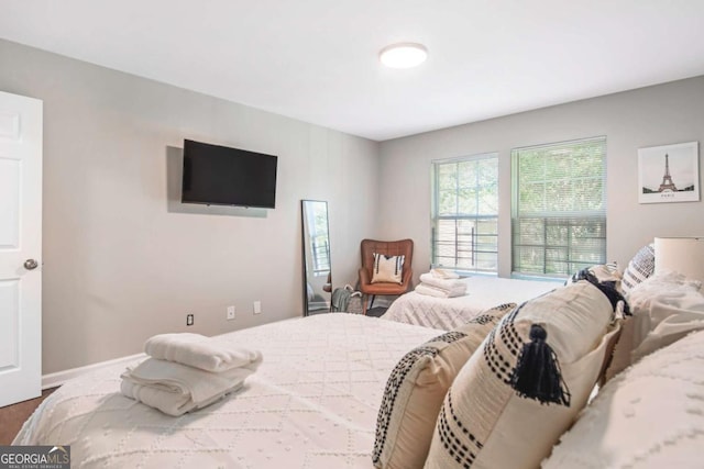 bedroom featuring baseboards