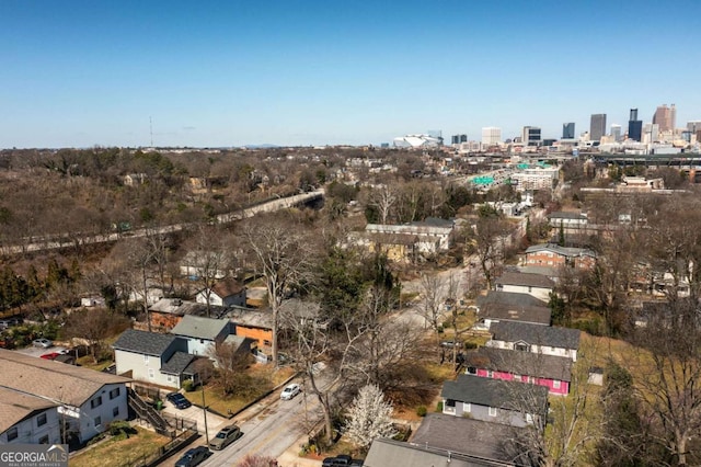 birds eye view of property featuring a city view