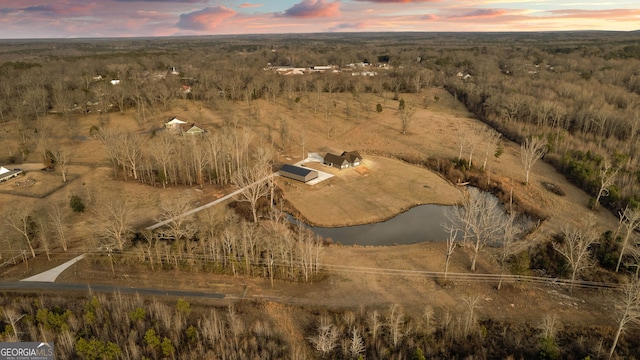 aerial view at dusk with a water view