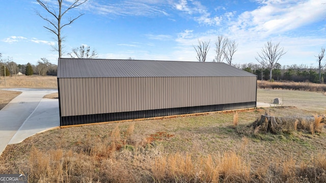 view of home's exterior with an outbuilding