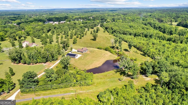 aerial view with a water view, a forest view, and a rural view