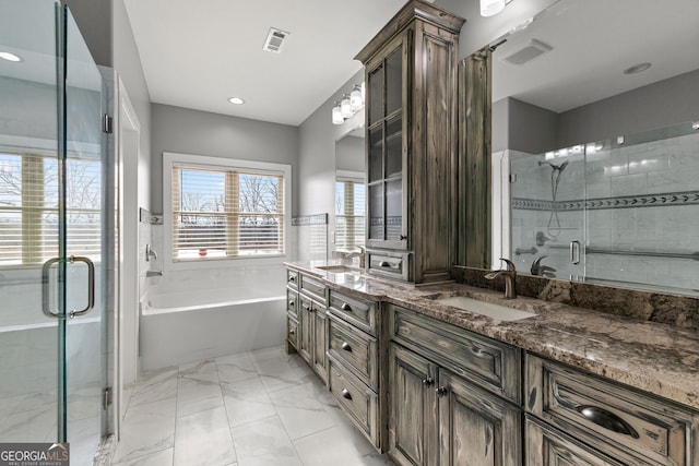 bathroom featuring double vanity, a sink, visible vents, and a shower stall