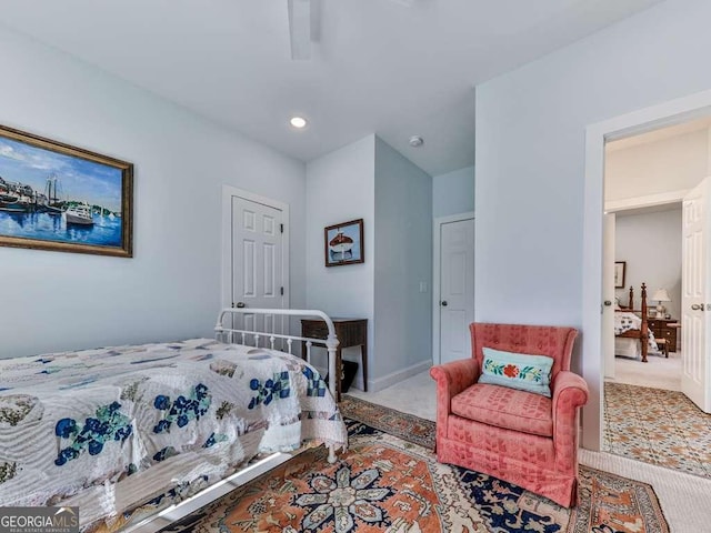 carpeted bedroom with a ceiling fan and baseboards