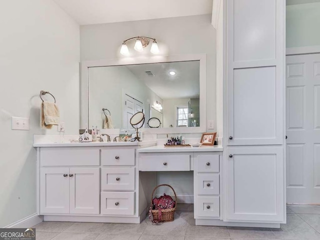 bathroom featuring visible vents, tile patterned flooring, vanity, and baseboards