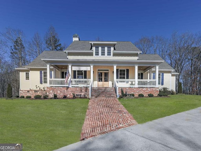 view of front of house featuring covered porch, crawl space, a chimney, and a front yard