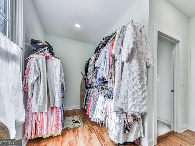 spacious closet with wood finished floors