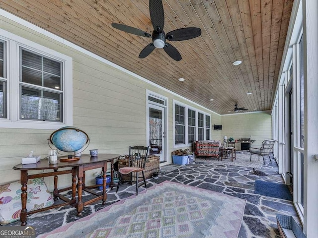 view of patio featuring a ceiling fan and an outdoor living space