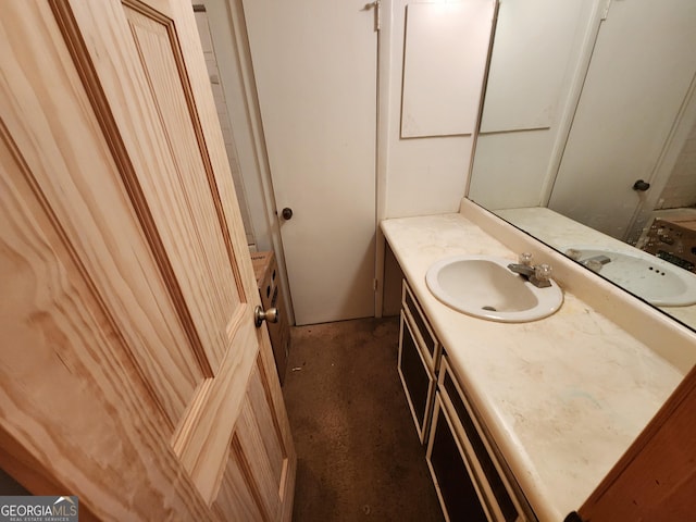 bathroom featuring concrete floors and vanity