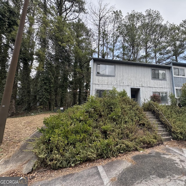 view of home's exterior featuring stairs