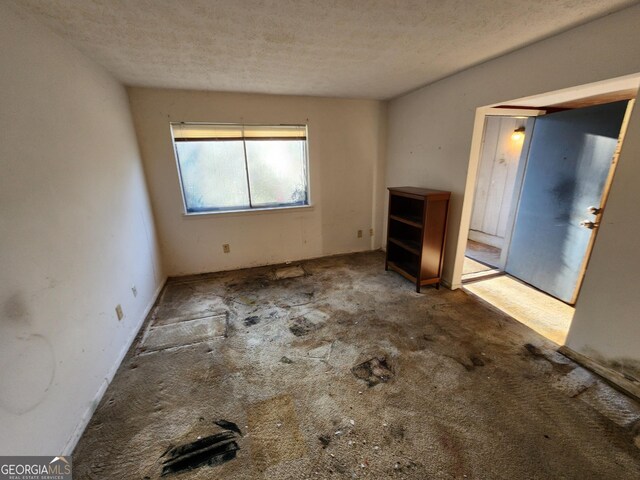 interior space featuring a textured ceiling