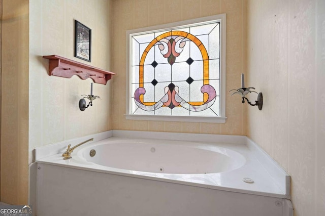 full bath with wallpapered walls and a garden tub