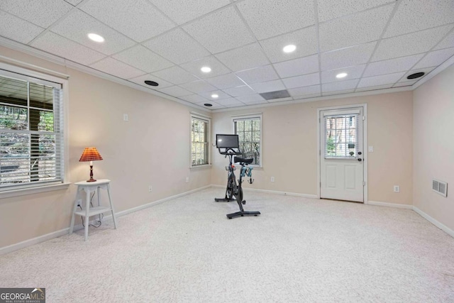 workout room with visible vents, a healthy amount of sunlight, baseboards, and carpet