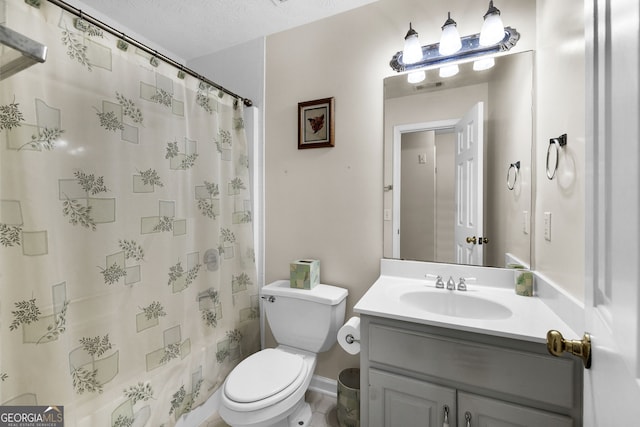 full bathroom featuring curtained shower, vanity, and toilet