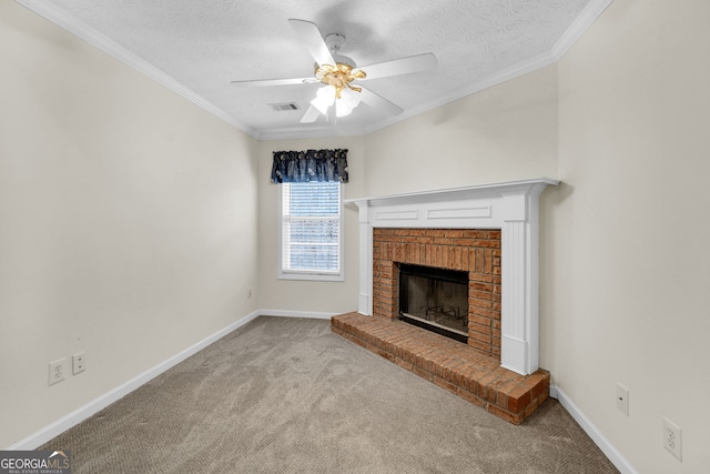 unfurnished living room featuring carpet floors, a fireplace, visible vents, baseboards, and crown molding