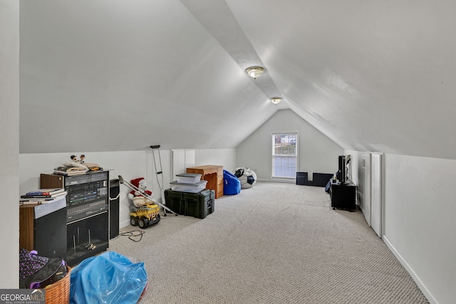 recreation room with lofted ceiling, carpet flooring, and baseboards