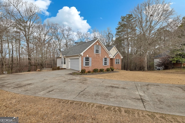 view of property exterior with brick siding, a yard, roof with shingles, a garage, and driveway