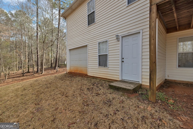 doorway to property featuring a garage