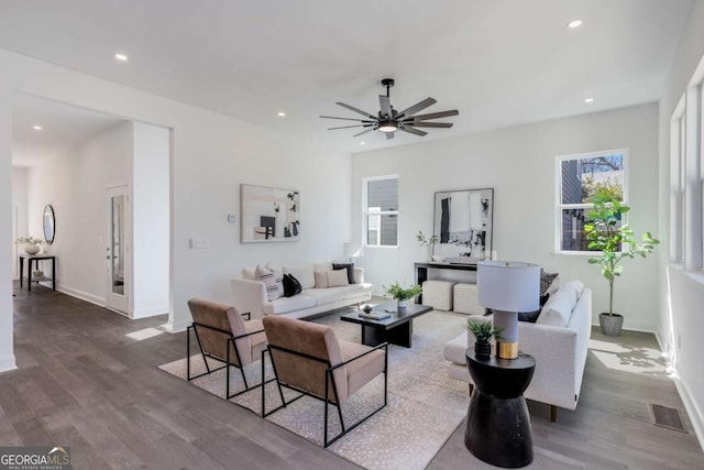 living room featuring dark wood-type flooring, recessed lighting, baseboards, and a ceiling fan