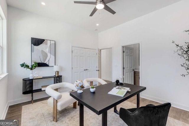 office area with baseboards, recessed lighting, a ceiling fan, and light wood-style floors