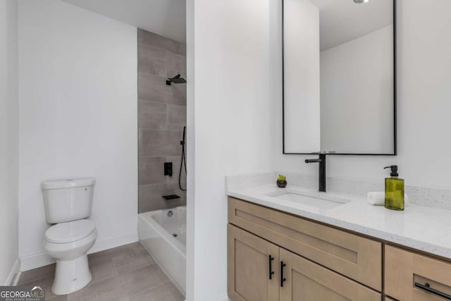 full bathroom with toilet, baseboards, shower / washtub combination, and vanity