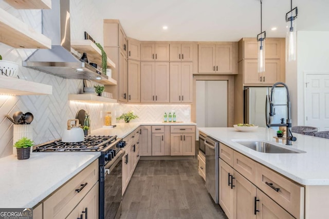 kitchen with open shelves, gas range oven, light countertops, a sink, and wall chimney range hood